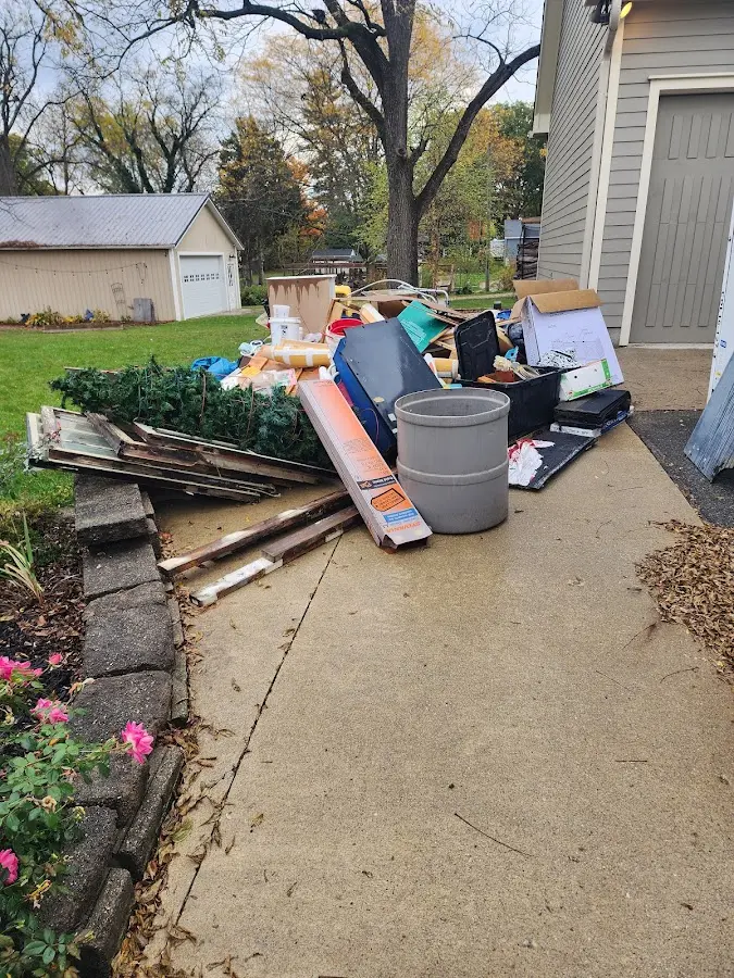 Dumpster being loaded with debris for Residential Dumpster Rental in Happy Valley